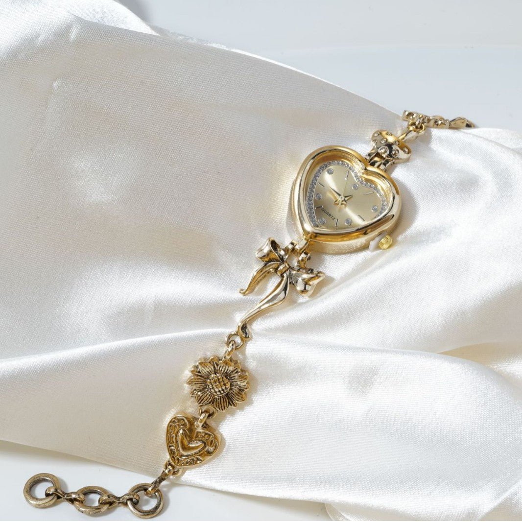 Retro Heart - shaped Bracelet Watch With A Golden Bow And Flower Design A Stylish Womens Timepiece - Oopsdadforgot.com
