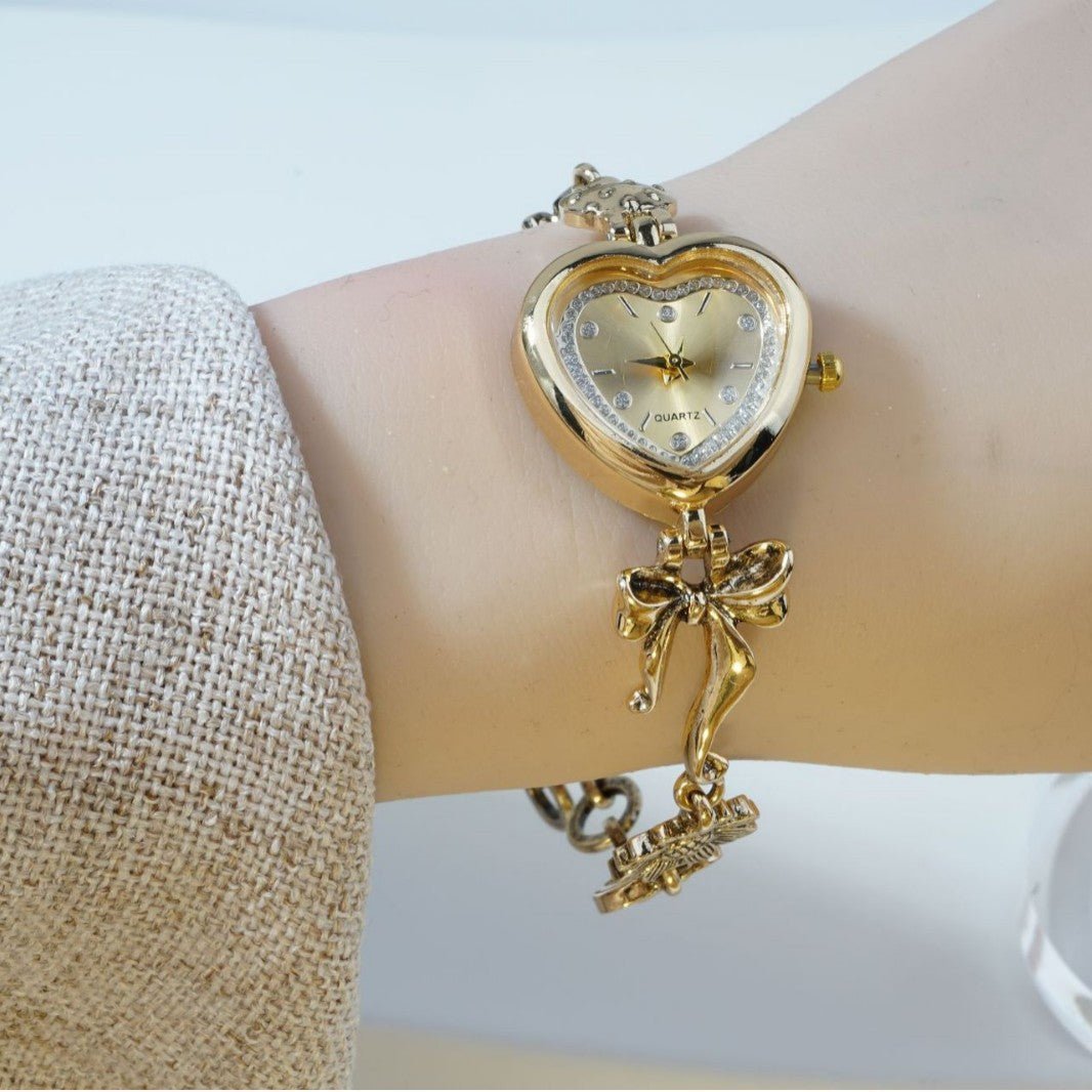 Retro Heart - shaped Bracelet Watch With A Golden Bow And Flower Design A Stylish Womens Timepiece - Oopsdadforgot.com