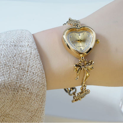 Retro Heart - shaped Bracelet Watch With A Golden Bow And Flower Design A Stylish Womens Timepiece - Oopsdadforgot.com